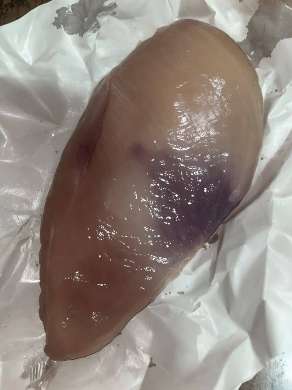 Why is there a purple spot on my chicken breast?